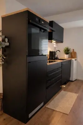 Küche/Küchenzeile in der Unterkunft MIRANA Home l Modernes Apartment Kaiserslautern