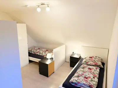 Ein Bett oder Betten in einem Zimmer der Unterkunft Vollausgestattete Wohnung für Selbstversorger