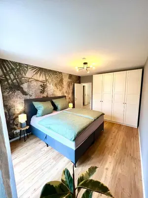 Ein Bett oder Betten in einem Zimmer der Unterkunft Stilvolles & helles Apartment mit Sonnen-Terrasse