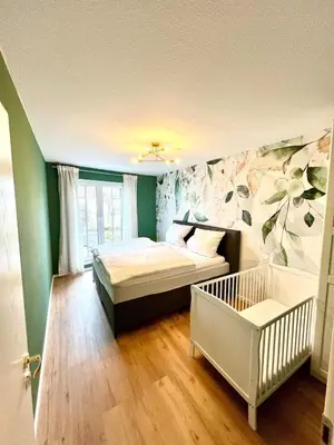 Ein Bett oder Betten in einem Zimmer der Unterkunft Stilvolles & helles Apartment mit Sonnen-Terrasse