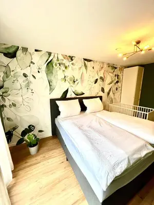 Ein Bett oder Betten in einem Zimmer der Unterkunft Stilvolles & helles Apartment mit Sonnen-Terrasse