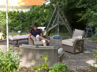 Ein Sitzbereich in der Unterkunft Apartment mit Pool und überdachtem Balkon by Interhome