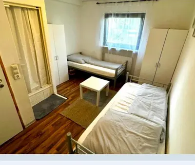 Ein Bett oder Betten in einem Zimmer der Unterkunft RoomZ Hostel am Hockenheimring