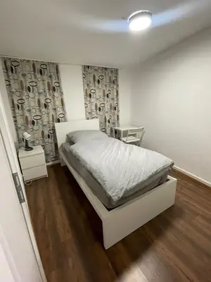 Ein Bett oder Betten in einem Zimmer der Unterkunft Haus Zum Bacchus Privates Unterkunft nahe Bahnhof Römisches Theater, Mainz