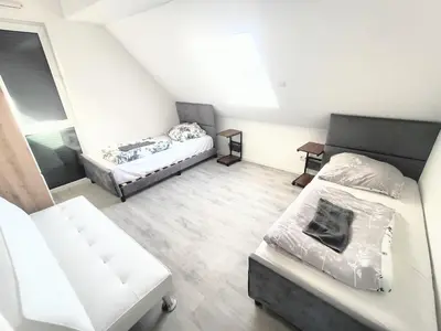 Ein Bett oder Betten in einem Zimmer der Unterkunft Apartment mit Balkon