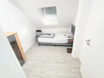 Ein Bett oder Betten in einem Zimmer der Unterkunft Apartment mit Balkon