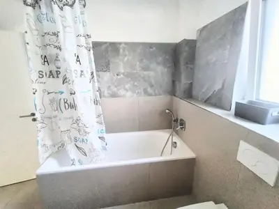 Ein Badezimmer in der Unterkunft Apartment mit Balkon