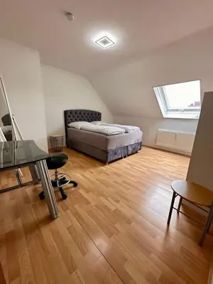 Ein Bett oder Betten in einem Zimmer der Unterkunft Country house style vintage 2-room apartment in Kleinostheim