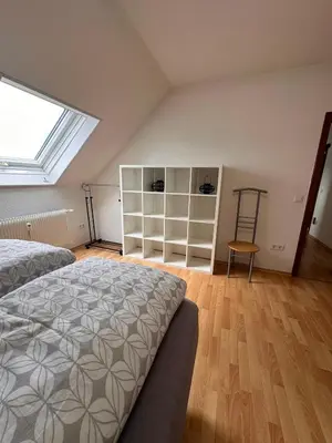 Ein Bett oder Betten in einem Zimmer der Unterkunft Country house style vintage 2-room apartment in Kleinostheim