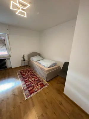 Ein Bett oder Betten in einem Zimmer der Unterkunft Land Lord Apartments 3-4 Sleeping Rooms near Frankfurt am Main