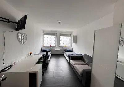 Ein Bett oder Betten in einem Zimmer der Unterkunft Lise Zimmer Zentral Bequem