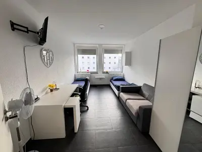 Ein Bett oder Betten in einem Zimmer der Unterkunft Lise Zimmer Zentral Bequem