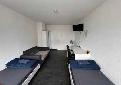 Ein Bett oder Betten in einem Zimmer der Unterkunft Lise Zimmer Zentral Bequem