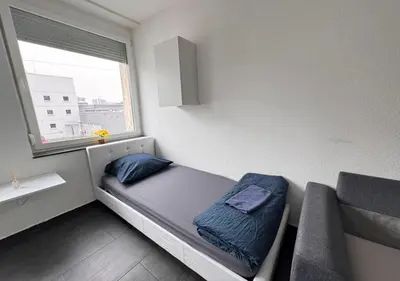 Ein Bett oder Betten in einem Zimmer der Unterkunft Lise Zimmer Zentral Bequem
