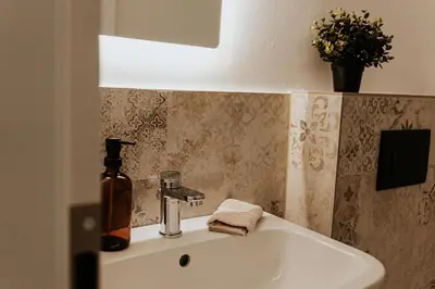Ein Badezimmer in der Unterkunft Exclusive penthouse apartment 5 with balcony & parking