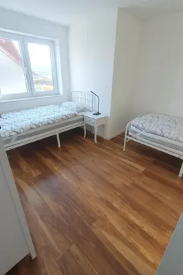 Ein Bett oder Betten in einem Zimmer der Unterkunft Schöne 3-Zimmer Neubauwohnung