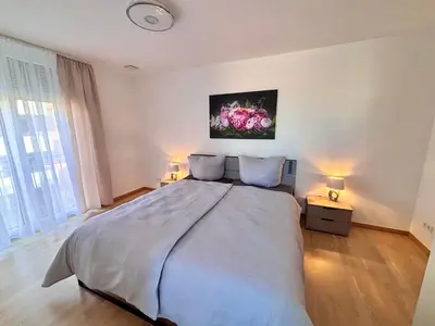 Ein Bett oder Betten in einem Zimmer der Unterkunft AG Deluxe Ferienwohnung in Kornwestheim