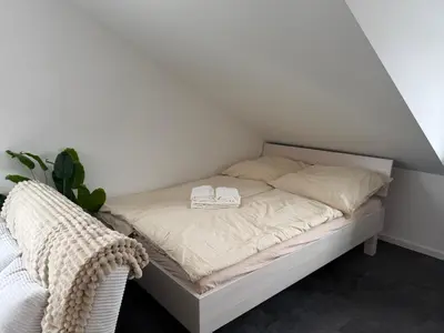 Ein Bett oder Betten in einem Zimmer der Unterkunft Ferienwohnung Verissimo
