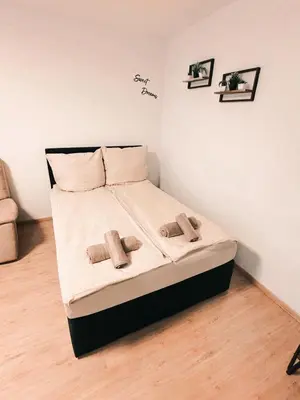 Ein Bett oder Betten in einem Zimmer der Unterkunft Ferienwohnung - gemütliches Heim Li-Apartments