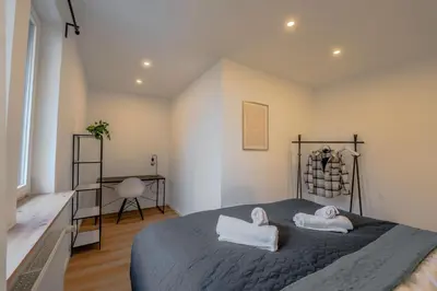 Ein Bett oder Betten in einem Zimmer der Unterkunft Schlossberg Residences XXL City-Apartment Heppenheim