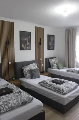 Ein Bett oder Betten in einem Zimmer der Unterkunft Wunderschöne 3-Zimmer Hilton Appartment Style - Ideal For Business and Family Trips - Near Frankfurt & Darmstadt