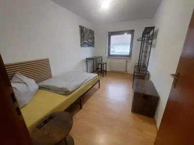 Ein Bett oder Betten in einem Zimmer der Unterkunft KiRoom Eberstadt 4