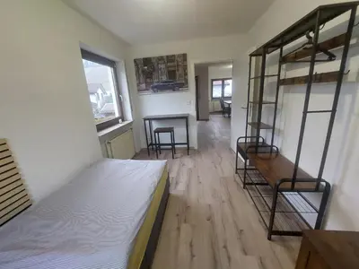 Ein Bett oder Betten in einem Zimmer der Unterkunft KiRoom Eberstadt 4