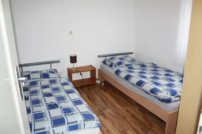 Ein Bett oder Betten in einem Zimmer der Unterkunft Monteur- und Ferienhaus Hirsch