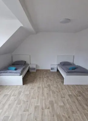 Ein Bett oder Betten in einem Zimmer der Unterkunft Privatpension Dreger
