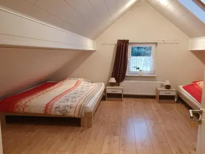 Ein Bett oder Betten in einem Zimmer der Unterkunft Gästehaus Alte Küferei