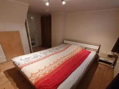 Ein Bett oder Betten in einem Zimmer der Unterkunft Gästehaus Alte Küferei