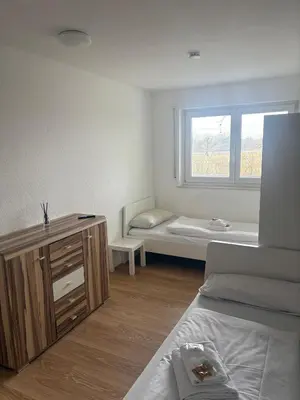 Ein Bett oder Betten in einem Zimmer der Unterkunft Teamhaus mit großer Küche - Platz für 10