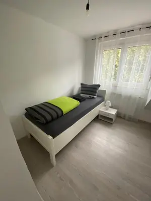 Ein Bett oder Betten in einem Zimmer der Unterkunft Goldstadt