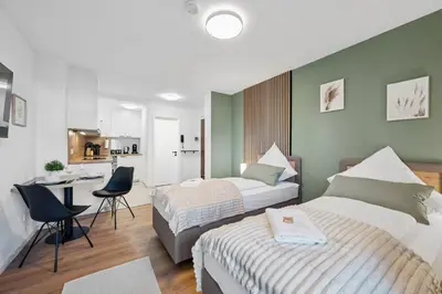 Ein Bett oder Betten in einem Zimmer der Unterkunft F&D Studio Apartment mit Parkplatz