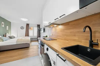Ein Bett oder Betten in einem Zimmer der Unterkunft F&D Studio Apartment mit Parkplatz