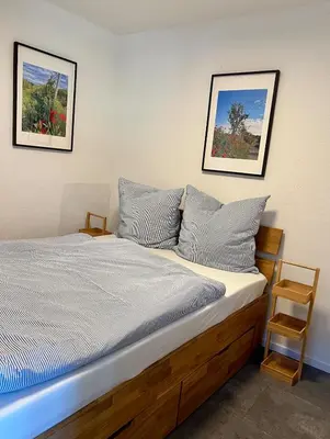 Ein Bett oder Betten in einem Zimmer der Unterkunft Wohnung mit besonderem Ausblick
