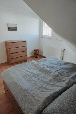 Ein Bett oder Betten in einem Zimmer der Unterkunft FeWo Kibo Kupferberg
