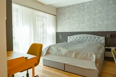 Ein Bett oder Betten in einem Zimmer der Unterkunft LUI CityApartment an der Weinstrasse - Boho Stil