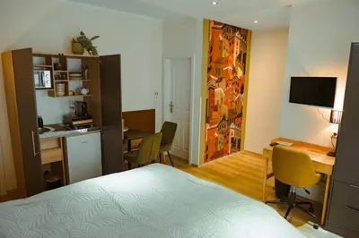 Ein Bett oder Betten in einem Zimmer der Unterkunft LUI CityApartment an der Weinstrasse - Boho Stil