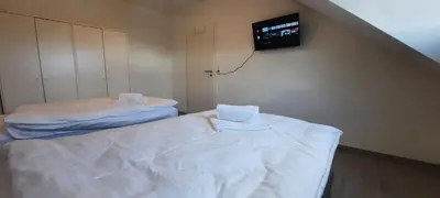 Ein Bett oder Betten in einem Zimmer der Unterkunft Moderne 2-Zimmer-Wohnung mit Balkon - ideal für 4 Gäste