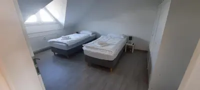 Ein Bett oder Betten in einem Zimmer der Unterkunft Moderne 2-Zimmer-Wohnung mit Balkon - ideal für 4 Gäste