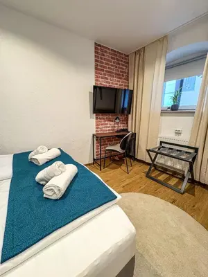 Ein Bett oder Betten in einem Zimmer der Unterkunft Neckarloft - Im Herzen der Altstadt