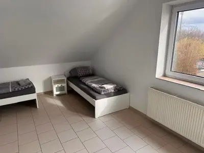 Ein Bett oder Betten in einem Zimmer der Unterkunft 4 Personen I 2 Schlafzimmer I Wohnung Wörrstadt mit Parkplatz