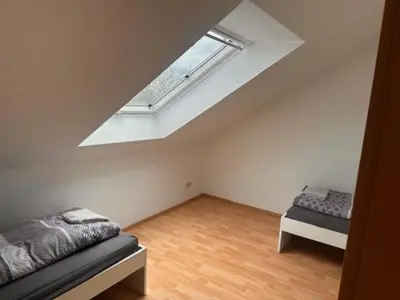 Ein Bett oder Betten in einem Zimmer der Unterkunft 4 Personen I 2 Schlafzimmer I Wohnung Wörrstadt mit Parkplatz