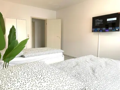 Ein Bett oder Betten in einem Zimmer der Unterkunft Wohnung 4 Eppertshausen