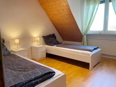 Ein Bett oder Betten in einem Zimmer der Unterkunft Wohnung Reinheim
