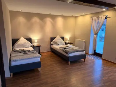 Ein Bett oder Betten in einem Zimmer der Unterkunft Monteur Darius