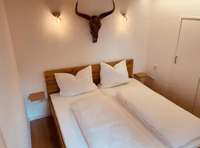 Ein Bett oder Betten in einem Zimmer der Unterkunft Ferienwohnung Weinbergtraum