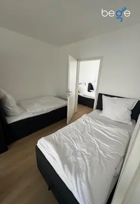 Ein Bett oder Betten in einem Zimmer der Unterkunft BEGE APARTMENTS BalanceBase