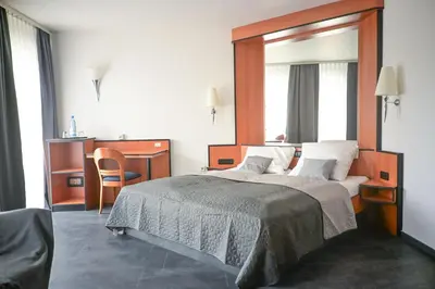 Ein Bett oder Betten in einem Zimmer der Unterkunft Steingarten Hotel